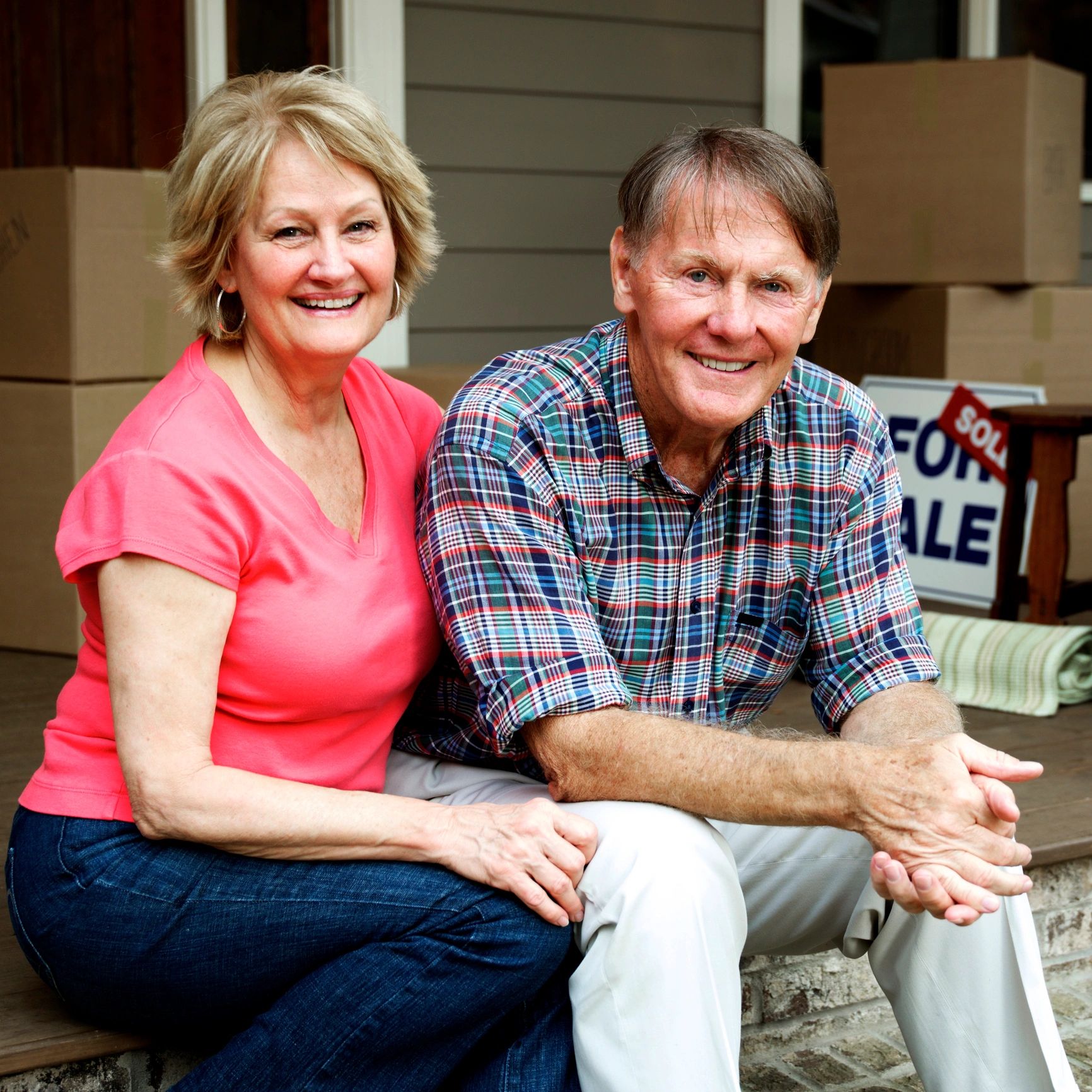 Homeowners outside a house